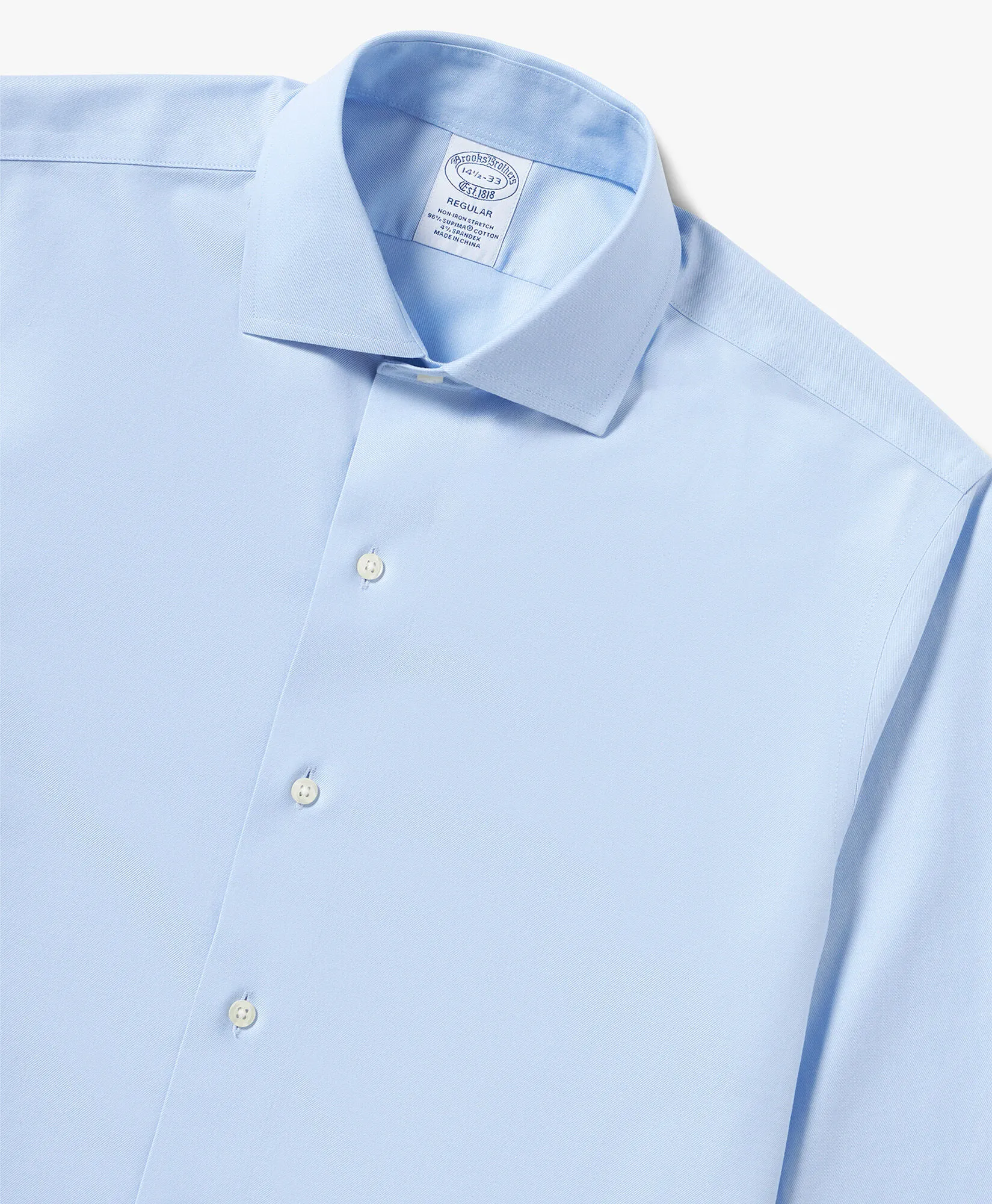 Camisa de algodón elástico azul pastel non-iron corte regular con cuello inglés abierto